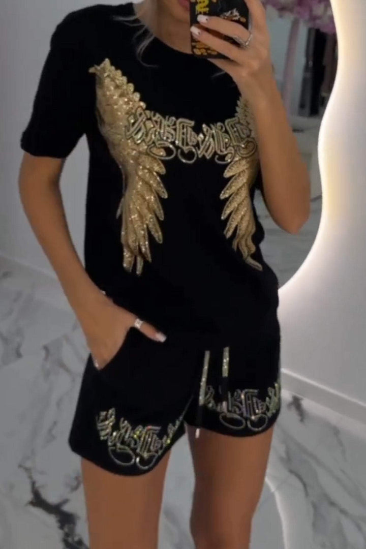 Dviejų dalių moteriškas ryškaus rašto viršus ir šortai