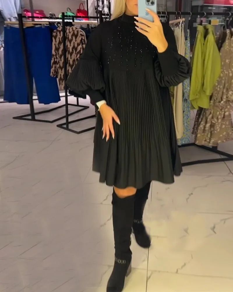 Fekete magas nyakú ruha lámpás ujjakkal